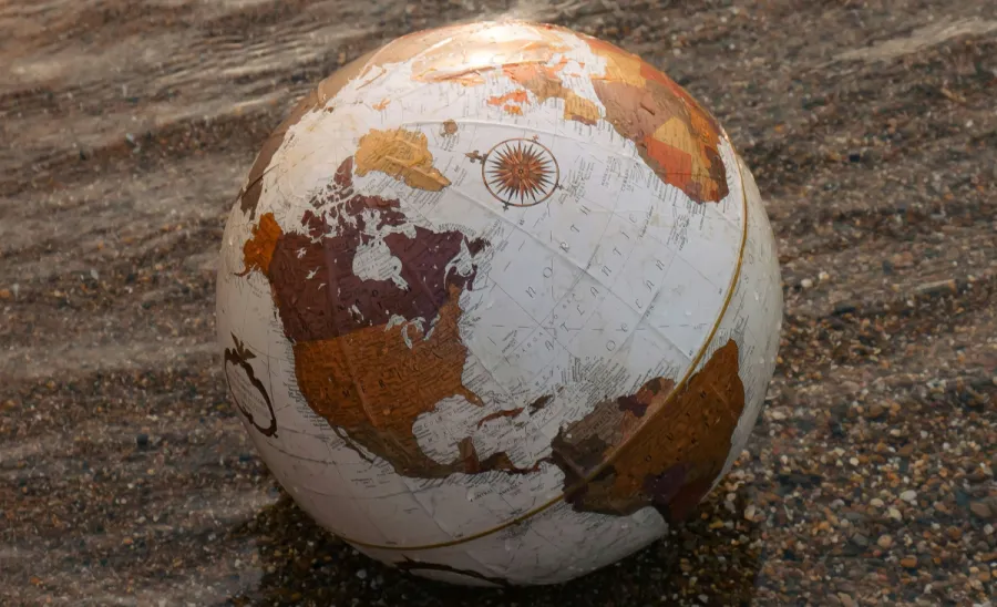 Globe on wet sand