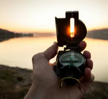 Image of a man using a compass