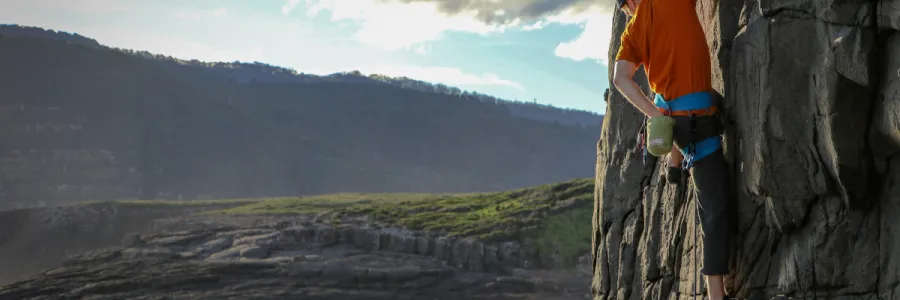 Image of man climbing mountain