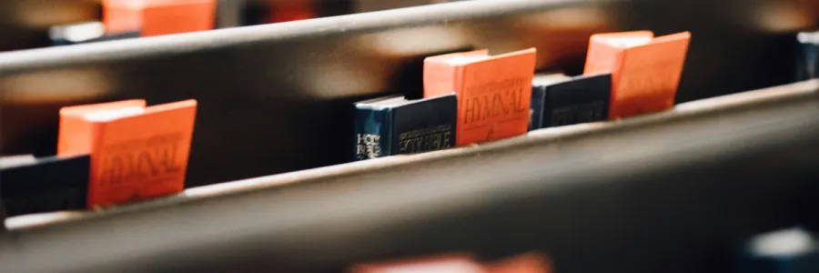 Photo of hymnals in church pews
